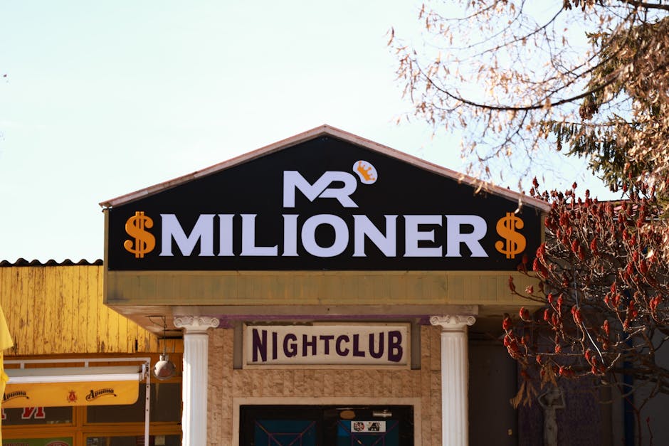 Exterior view of Mr Milioner Nightclub with signage in Bulgaria during daytime.